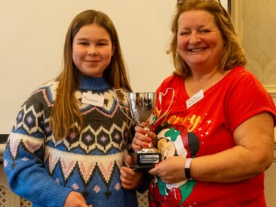 Pam Moon presenting Olivia Mingham with the Calpurnia Cup. This is awarded in the region to the junior showing outstanding achievements.