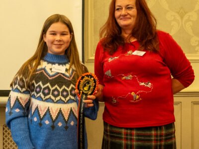 Liz Brown presenting Olivia Mingham with the Outstanding Achievement Award -Driving Donkeys against adults and also horses!