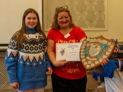 Olivia Mingham being presented with the National Points Winner Shield. Olivia also won the Young Handler Championship and Ridden Championship at the Championship Show